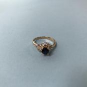 A 14ct gold sapphire and diamond ring