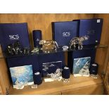 A collection of boxed Swarovski crystal ornaments