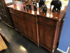 A reproduction mahogany sideboard