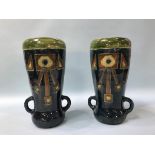A pair of Art Pottery two handled tapering vases, decorated with geometric designs, 35cm height