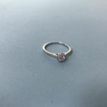 A 9ct white gold diamond ring with halo setting, 0.38ct