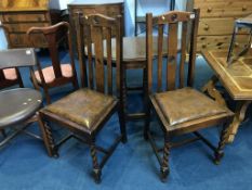 An oak gateleg barley twist table and a pair of chairs