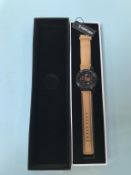 An automatic Weird Ape men's Kolt watch, with black skeleton face, red batons and beige suede strap