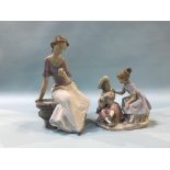 A Nao figure of a seated girl, number 1392, 29cm height and another group of two children holding