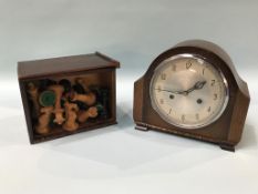 A mantle clock and chess pieces etc.