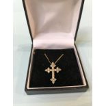An 18ct gold crucifix, with 1ct diamonds and chain