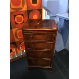 A reproduction mahogany chest of drawers