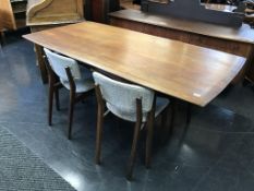 A Dalescraft Afromosia dining table and four chairs