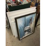 A collection of assorted framed prints
