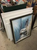 A collection of assorted framed prints