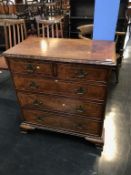 A good quality reproduction walnut chest of drawers