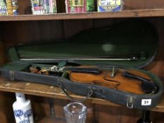 A violin and bow in fitted case, 59cm long approx.