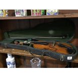 A violin and bow in fitted case, 59cm long approx.