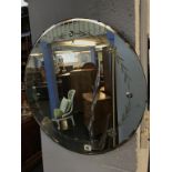 A circular frameless mirror