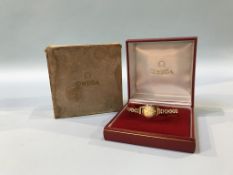 A ladies 9ct Omega watch, boxed with some papers