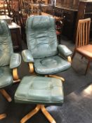 A green leather stressless style recliner and footstool