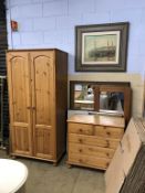 A pine wardrobe and chest of drawers, various pictures and mirrors