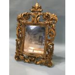 A gilt framed mirror