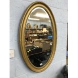 A gilt framed mirror