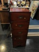 A modern mahogany campaign style chest of drawers