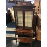 A reproduction glazed mahogany display cabinet