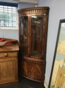 A good quality reproduction corner cabinet