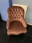 A button back armchair