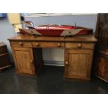 A mahogany twin pedestal sideboard