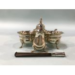A pair of silver salts, a pepper pot and a silver mounted cigarette holder