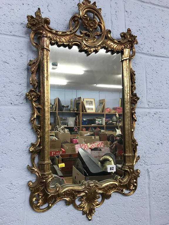 A gilt framed mirror