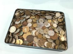 A tin of various coins