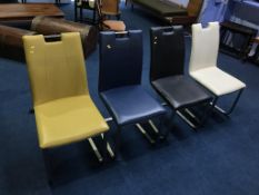 A set of four leather dining chairs
