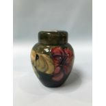 A Moorcroft vase and cover, decorated with 'Hibiscus', 15cm height