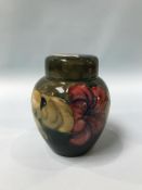 A Moorcroft vase and cover, decorated with 'Hibiscus', 15cm height