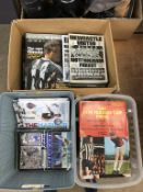 A quantity of football programmes