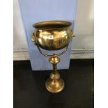 A brass jardinere and stand