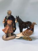 A Royal Doulton 'Good King Wenceslas', a Beswick pigeon and a horse