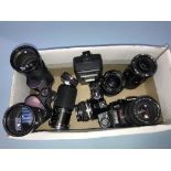 Various lenses, binoculars and an Olympus 0M-2SP camera etc.