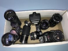 Various lenses, binoculars and an Olympus 0M-2SP camera etc.