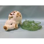 A green glass dressing table set and a large pottery pig money box