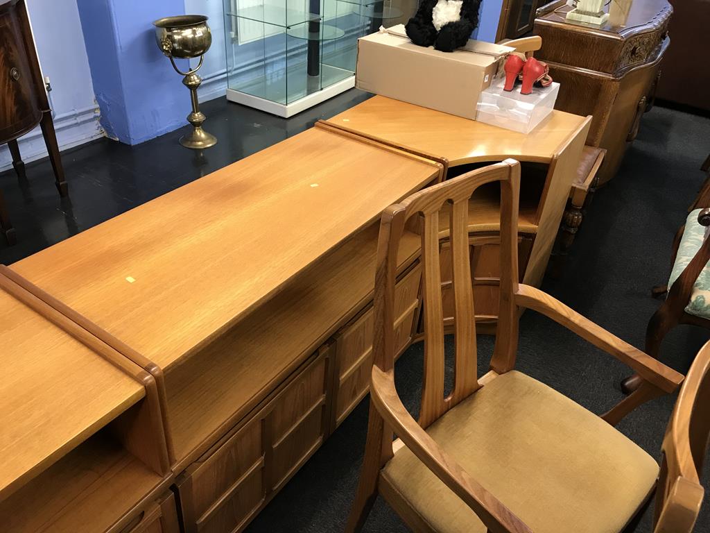 A teak extending dining table and six chairs, three matching units, together with an oak sliding - Image 4 of 4