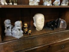 Two pairs of bookends, Oriental carved lions, a carved bust etc.