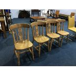 A set of four pine kitchen chairs