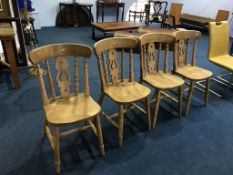 A set of four pine kitchen chairs