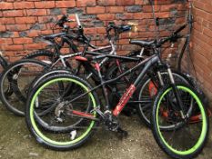 Four various mountain bikes