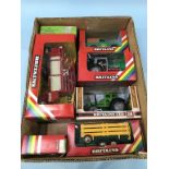 A collection of boxed Britains toys