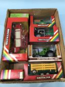 A collection of boxed Britains toys