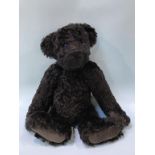 A Beechfield black plush teddy bear