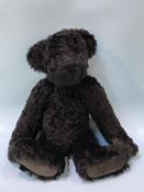 A Beechfield black plush teddy bear