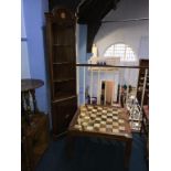 A teak table and a corner cabinet